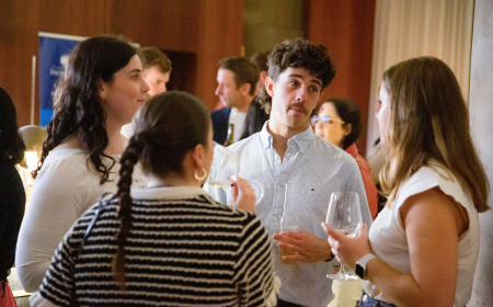 Alumni networking at a global event in Vancouver.